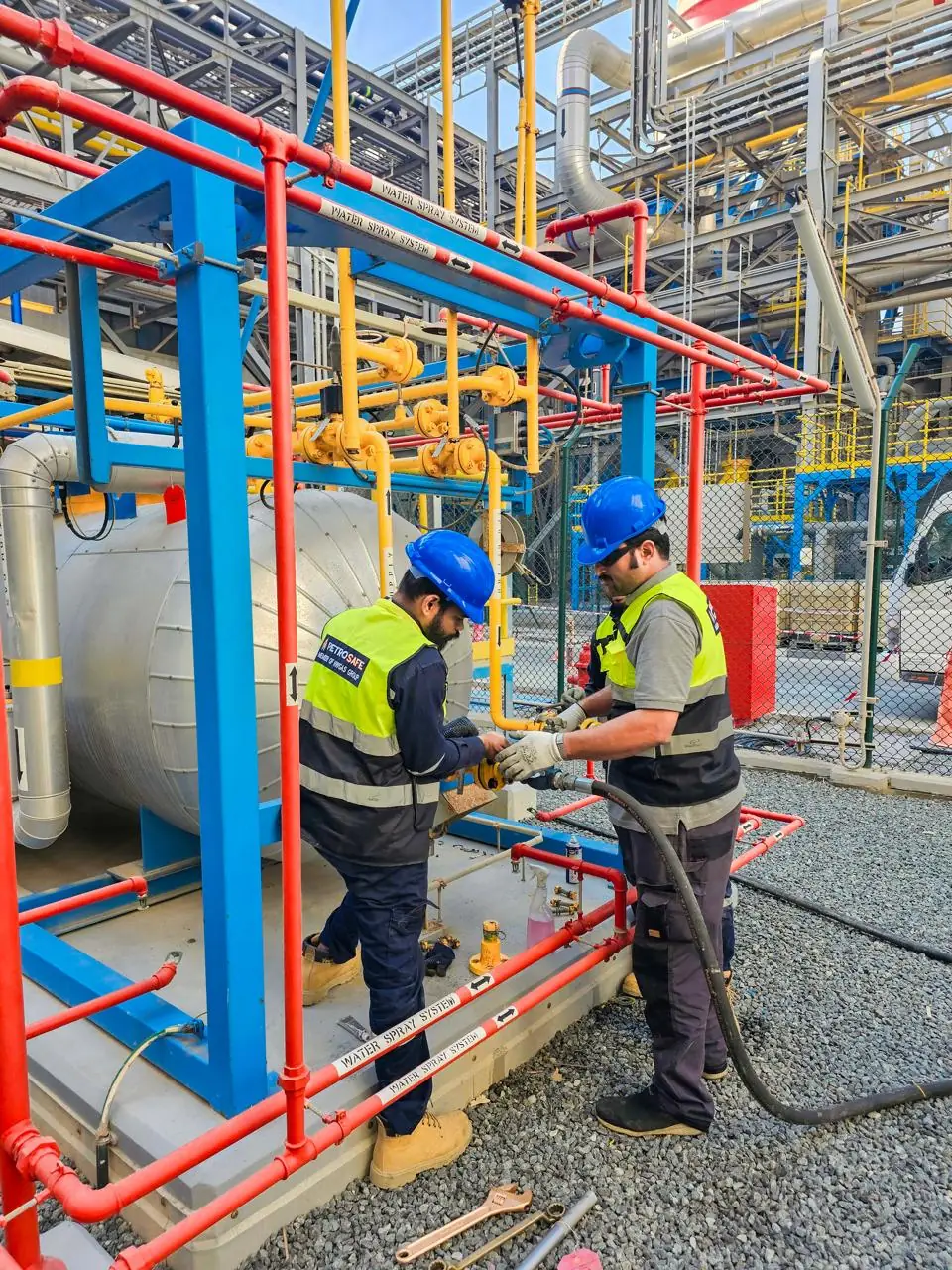 Petrosafe technicians working on a gas tank on site
